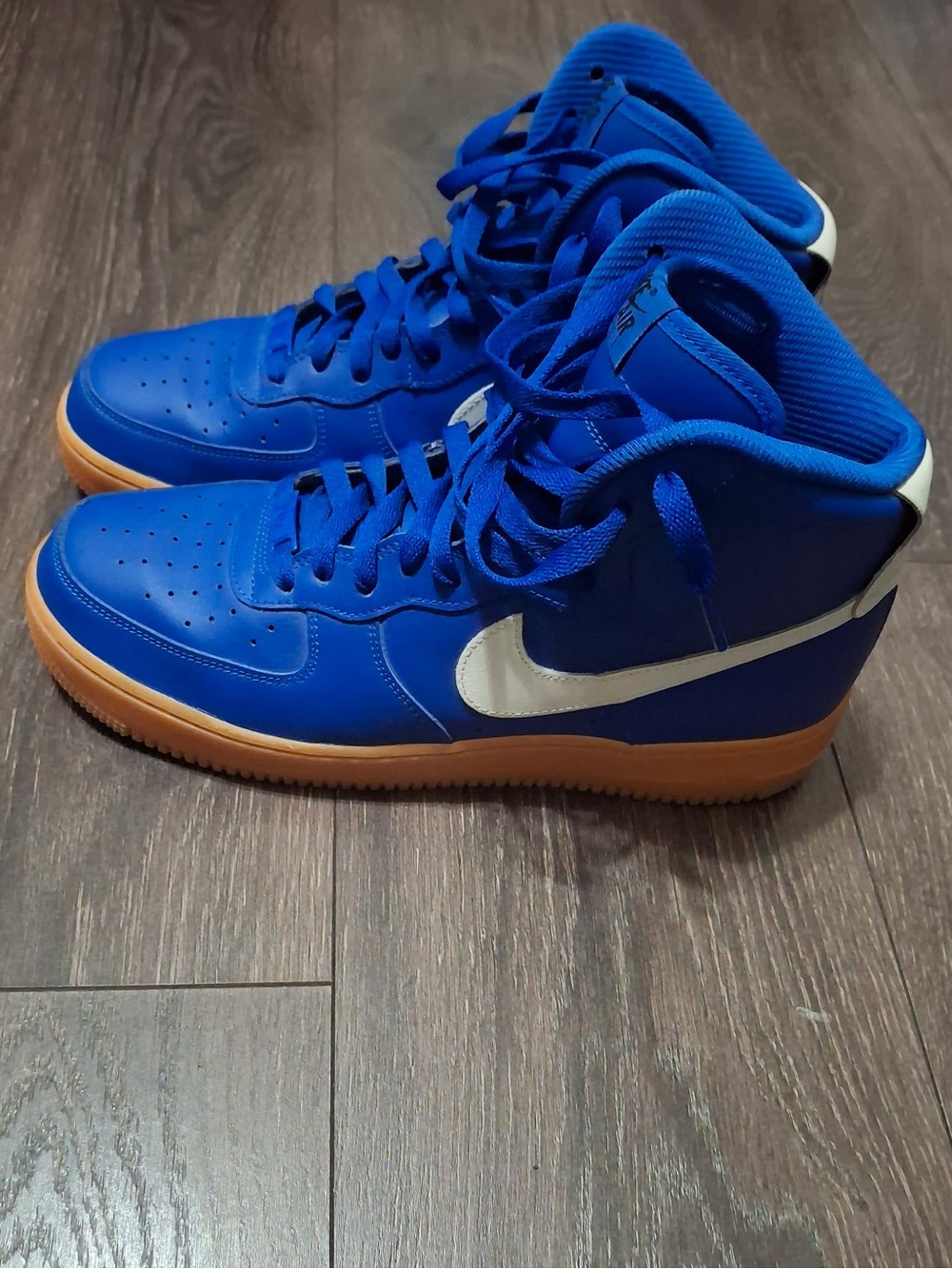 Nike Men's Blue High-Top Sneakers with White Swoosh and Gum Sole